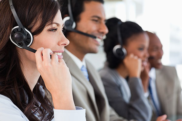 customer support staff with their headsets on